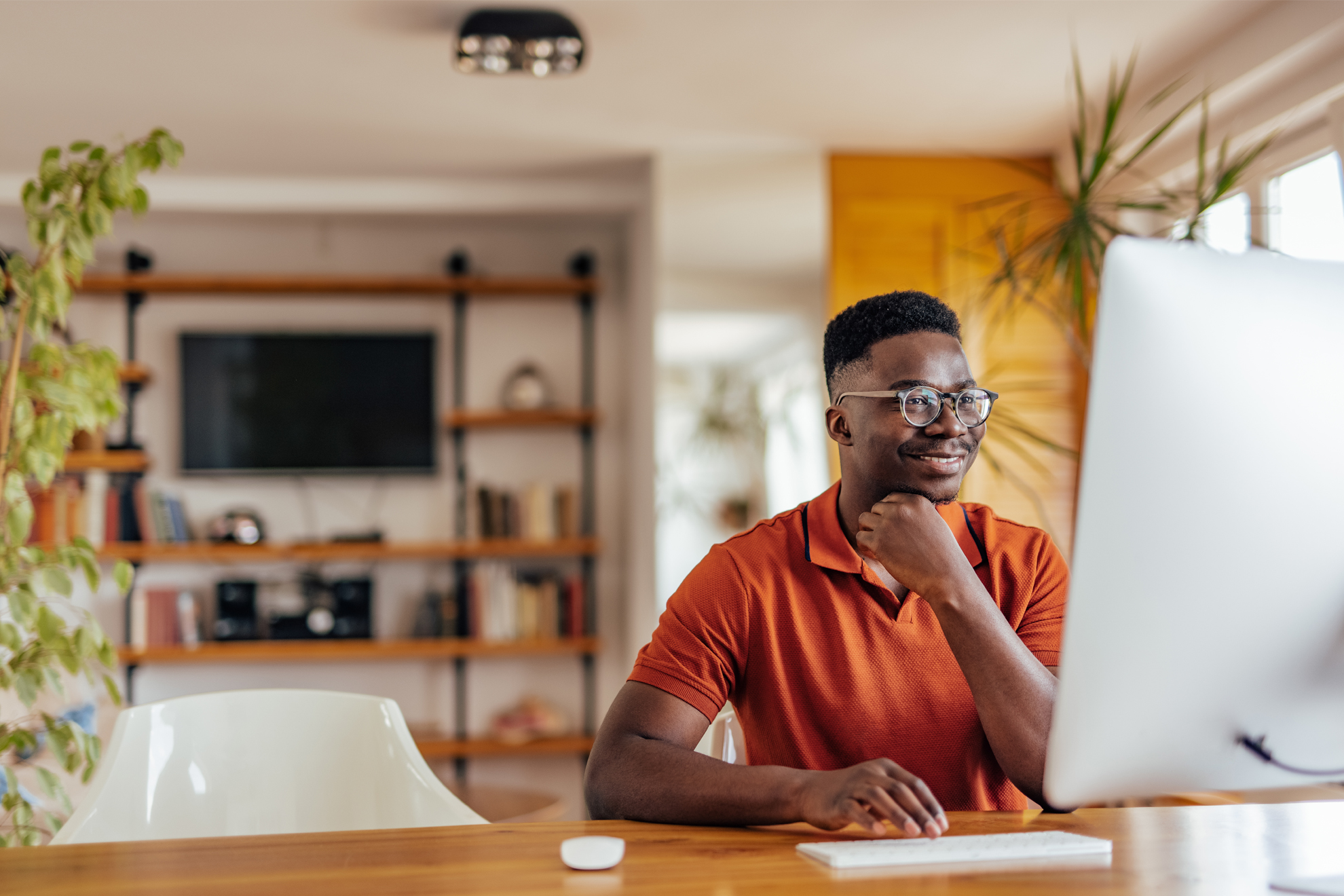 1shutterstock_1988229908 Man using computer. Reading articles about fraud.