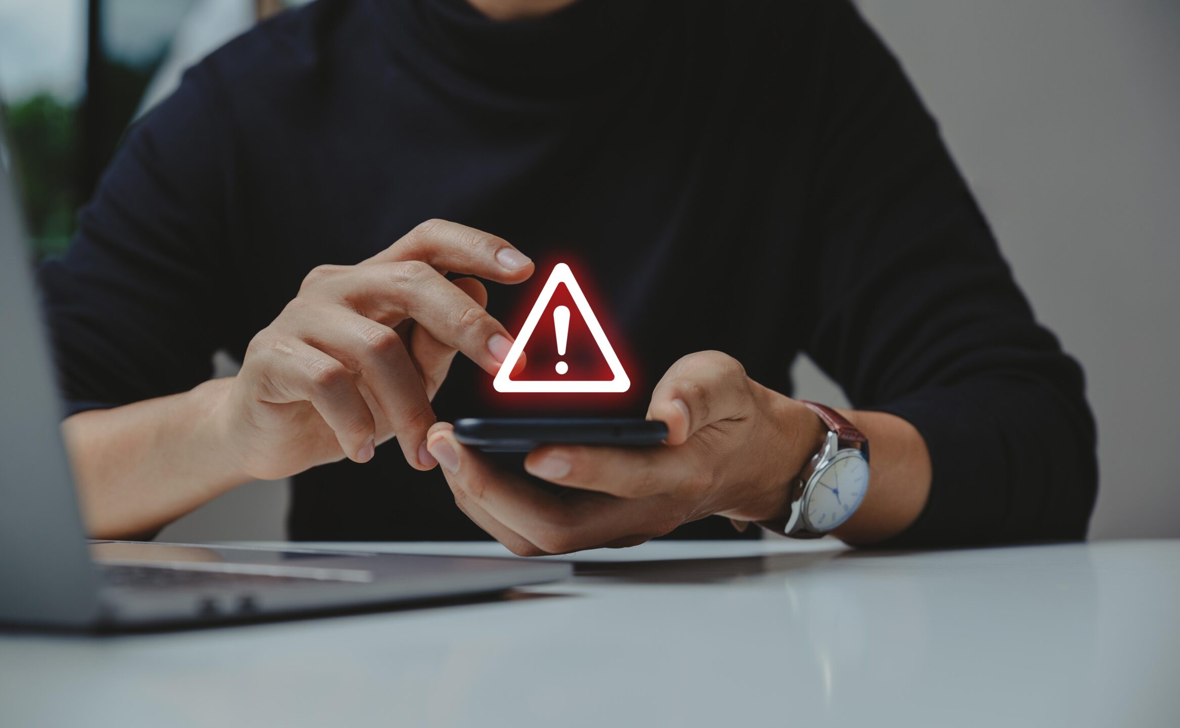 Caution,In,Investing,Economic,Situation,Warning,,Phishing,And,Internet,Security Caution in investing Economic situation warning, Phishing and internet security concept, Businessman using smartphone with warning sign.