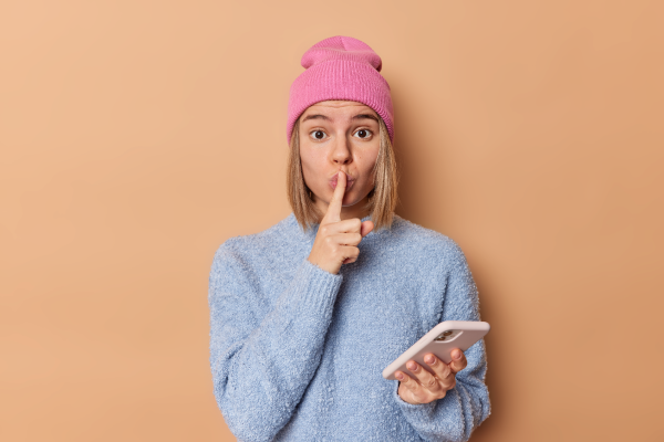 Lady making shush gesture